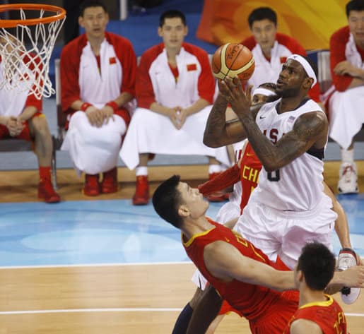 Lebron James shoots over Yao Ming.