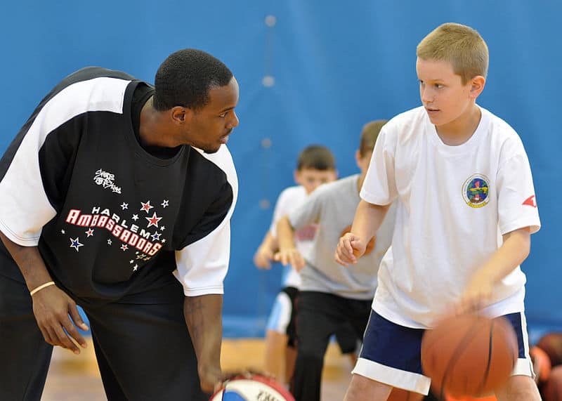 Coach training a kid